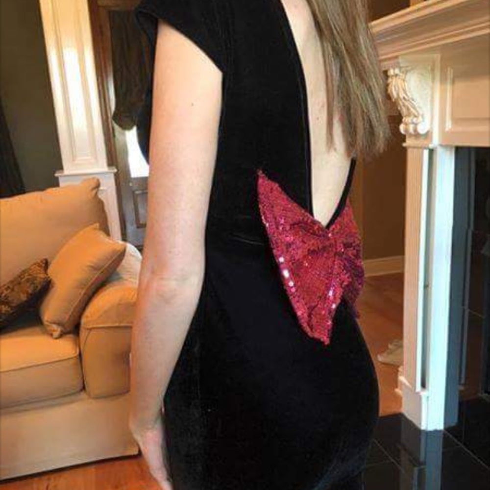 Black velvet dress with low back sequin bow